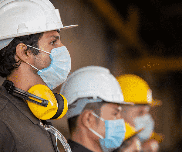 Construction Workers With Masks and Hardhats