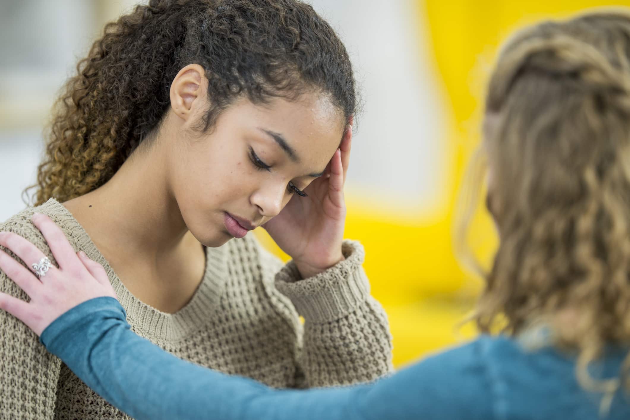 Sad Female Consoled By Friend