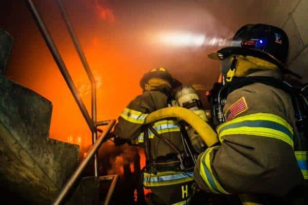 Firefighters fighting a fire.Moral injury in the fire service impacts firefighters and EMS personnel.