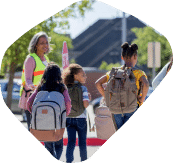 Safety worker ushering school children